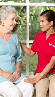 A happy senior and a caring healthcare worker